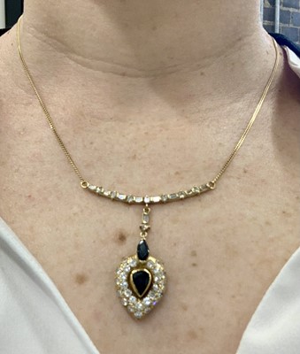 Lot 80 - A sapphire and diamond pendant necklace, circa 1987