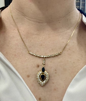 Lot 80 - A sapphire and diamond pendant necklace, circa 1987