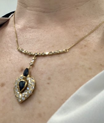 Lot 80 - A sapphire and diamond pendant necklace, circa 1987