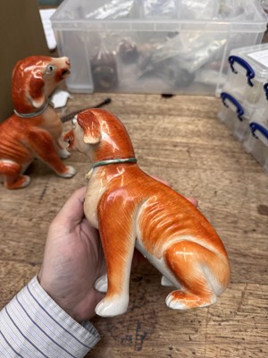 Lot 54 - A pair of fine Chinese export 'seated hounds' figures, Qing dynasty, Qianlong period