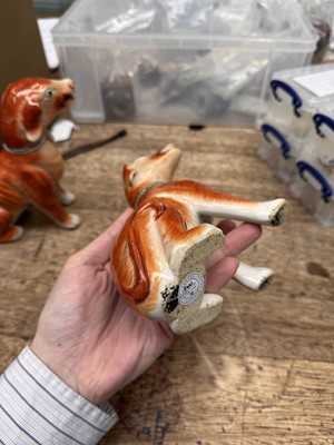 Lot 54 - A pair of fine Chinese export 'seated hounds' figures, Qing dynasty, Qianlong period