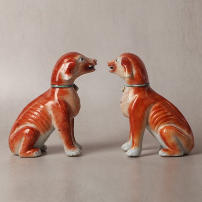 Lot 54 - A pair of fine Chinese export 'seated hounds' figures, Qing dynasty, Qianlong period