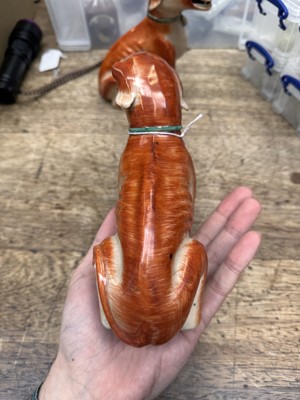 Lot 54 - A pair of fine Chinese export 'seated hounds' figures, Qing dynasty, Qianlong period