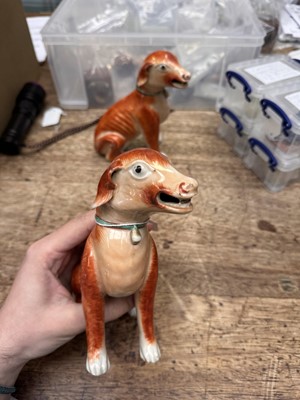 Lot 54 - A pair of fine Chinese export 'seated hounds' figures, Qing dynasty, Qianlong period