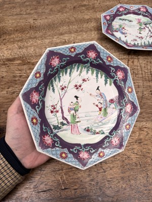 Lot 52 - A pair of fine Chinese export octagonal 'lady and child' dishes, Qing dynasty, Yongzheng period