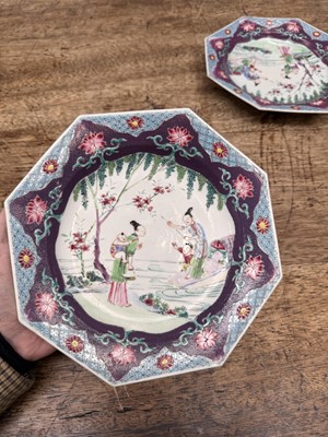 Lot 52 - A pair of fine Chinese export octagonal 'lady and child' dishes, Qing dynasty, Yongzheng period