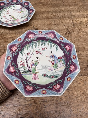 Lot 52 - A pair of fine Chinese export octagonal 'lady and child' dishes, Qing dynasty, Yongzheng period
