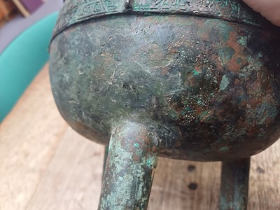 Lot 26 - A CHINESE ARCHAIC BRONZE RITUAL FOOD VESSEL, DING