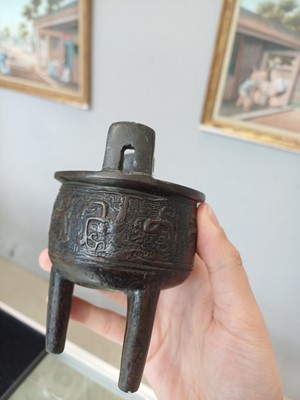 Lot 663 - A SMALL CHINESE ARCHAISTIC BRONZE TRIPOD CENSER