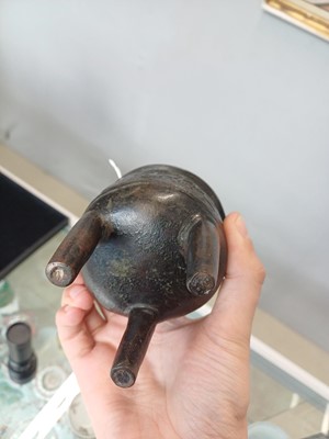 Lot 663 - A SMALL CHINESE ARCHAISTIC BRONZE TRIPOD CENSER