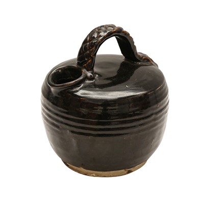 Lot 662 - A Chinese Henan black-glazed chamber pot, Ming dynasty