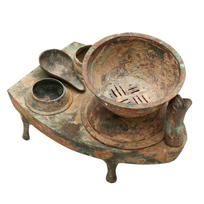 Lot 519 - A Chinese bronze zoomorphic cooking stove, zao, Han dynasty