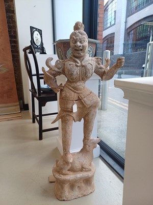 Lot 111 - A LARGE CHINESE POTTERY FIGURE OF LOKAPALA