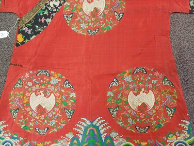 Lot 131 - A CHINESE MANCHU NOBLEWOMAN'S INFORMAL KESI SILK RED-GROUND ROBE, DANPAO