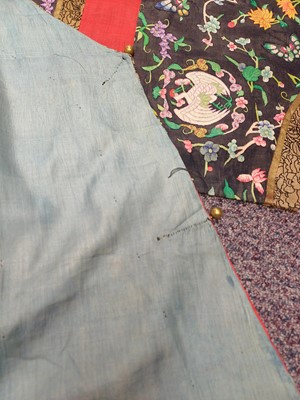 Lot 131 - A CHINESE MANCHU NOBLEWOMAN'S INFORMAL KESI SILK RED-GROUND ROBE, DANPAO