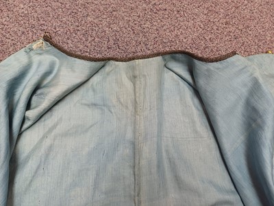 Lot 131 - A CHINESE MANCHU NOBLEWOMAN'S INFORMAL KESI SILK RED-GROUND ROBE, DANPAO