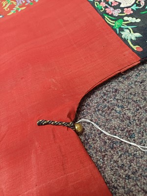Lot 131 - A CHINESE MANCHU NOBLEWOMAN'S INFORMAL KESI SILK RED-GROUND ROBE, DANPAO