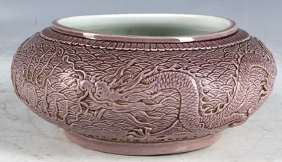 Lot 103 - A Chinese bowl, carved study of open mouthed...