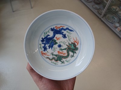 Lot 689 - A CHINESE DOUCAI 'DRAGON AND CRANES' DISH