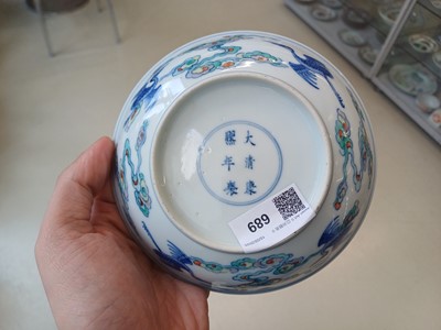Lot 689 - A CHINESE DOUCAI 'DRAGON AND CRANES' DISH