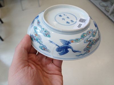 Lot 689 - A CHINESE DOUCAI 'DRAGON AND CRANES' DISH