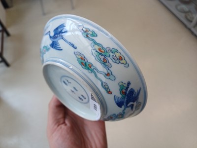 Lot 689 - A CHINESE DOUCAI 'DRAGON AND CRANES' DISH