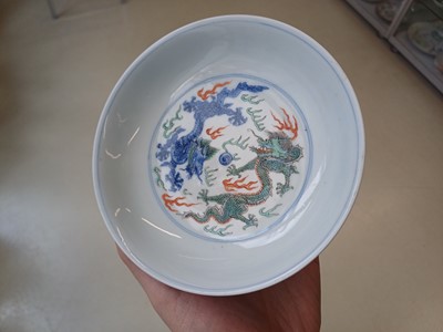Lot 689 - A CHINESE DOUCAI 'DRAGON AND CRANES' DISH