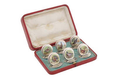 Lot 217 - A CASED SET OF SIX EDWARDIAN STERLING SILVER AND ENAMEL MENU HOLDERS, CHESTER 1905 BY SAMPSON MORDAN AND CO