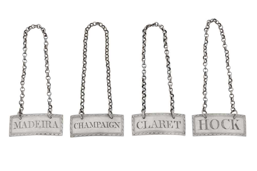 Lot 42 - A set of four George III Irish silver wine labels, Dublin circa 1810 by James Fray, retailed by Jacob West