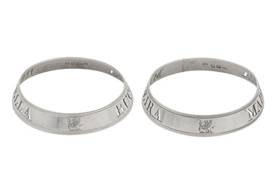 Lot 32 - A pair of George III sterling silver wine label bottle collars, London 1799 by Thomas Phipps and Edward Robinson