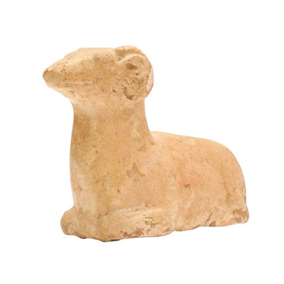 Lot 120 - A Chinese straw-glazed pottery figure of a ram, Tang dynasty