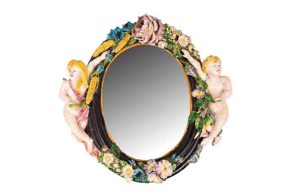 Lot 87 - A Continental majolica oval wall mirror, late 19th / early 20th century