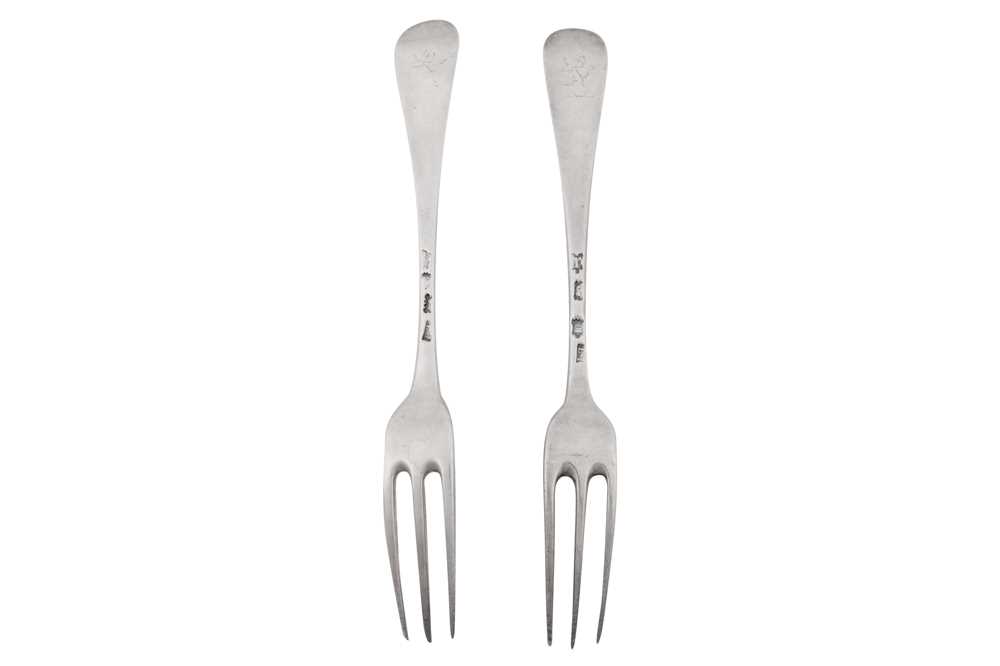 Lot 431 - A pair of George II sterling silver table forks, London 1750/52 by James Tookey (reg. 11th May 1750)