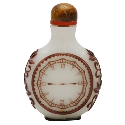 Lot 737 - A Chinese brown and white overlay glass 'pocket watch' snuff bottle, 18th/19th century