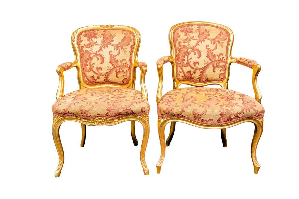 Lot 53 - A near pair of Louis XV style giltwood fauteuils, mid to late 19th century