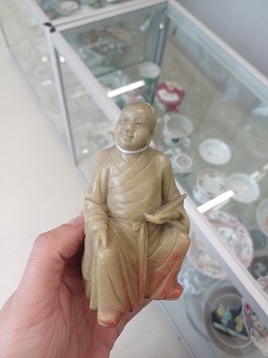 Lot 643 - A PAIR OF CHINESE CARVED SOAPSTONE DAOIST FIGURES