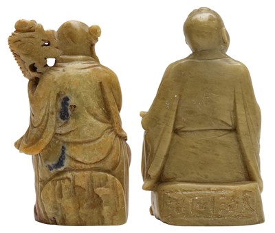 Lot 643 - A PAIR OF CHINESE CARVED SOAPSTONE DAOIST FIGURES