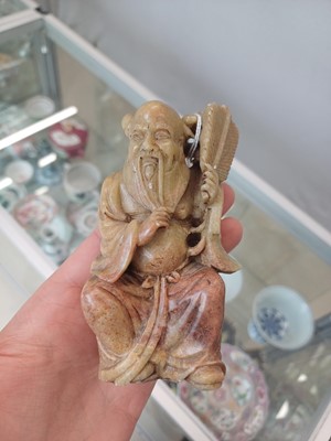 Lot 643 - A PAIR OF CHINESE CARVED SOAPSTONE DAOIST FIGURES