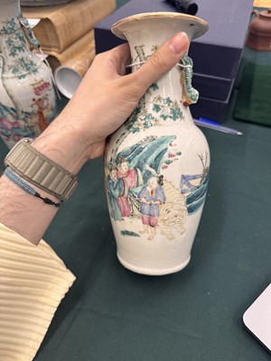 Lot 501 - A pair of Chinese famille-rose 'figural' vases, Qing dynasty, 19th century