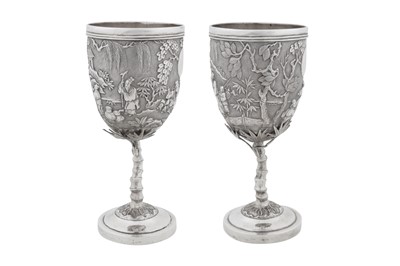 Lot 225 - A pair of early 20th century Chinese export silver goblets, Canton circa 1910, marked Pei Ji, retailed by Tian Sheng of Hong Kong