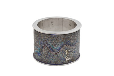 Lot 223 - An early 20th century Chinese export parcel gilt silver and enamel napkin ring, Peking (Beijing) circa 1920, marked Zhou He Zhang