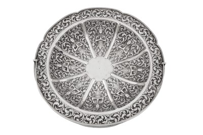 Lot 217 - A mid-20th century Cambodian unmarked silver swing handled basket, circa 1960