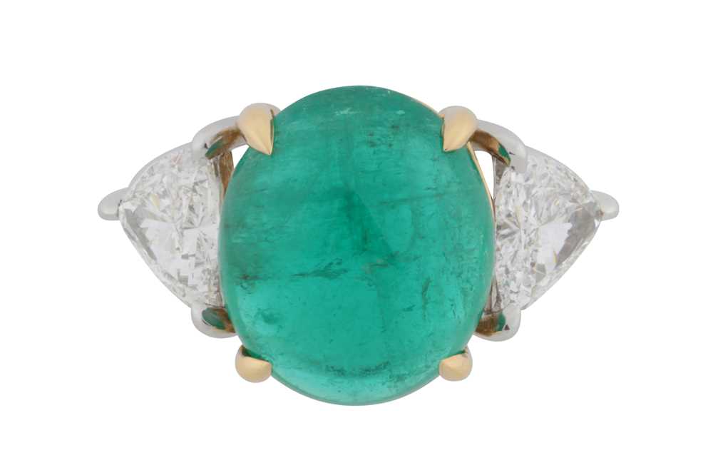 Lot 109 - An emerald and diamond three-stone ring
