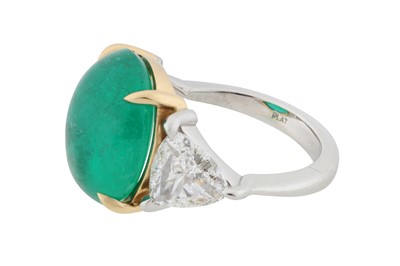 Lot 109 - An emerald and diamond three-stone ring