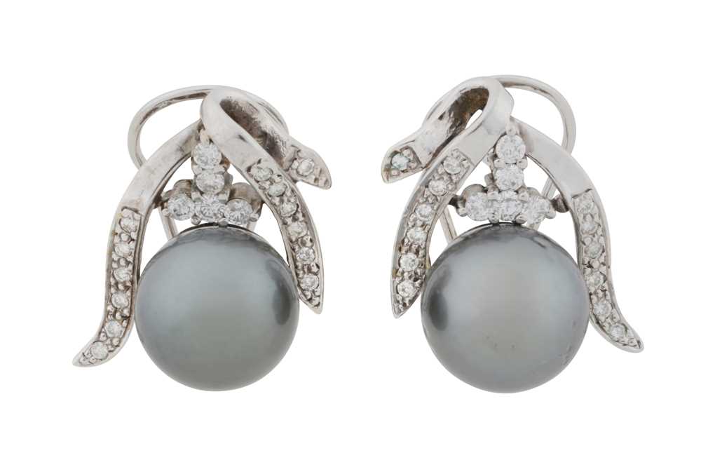 Lot 175 - A pair of pearl and diamond earrings