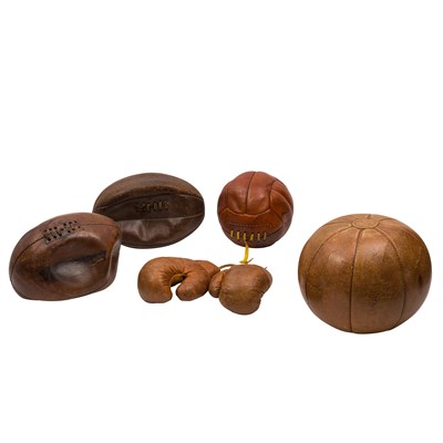 Lot 440 - A group of early to mid-20th century tan leather sporting balls