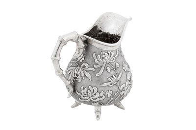 Lot 226 - An early 20th century Chinese export silver three-piece tea service, Canton or Hong Kong circa 1910, marked De Long