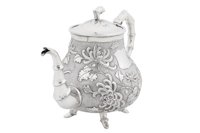 Lot 226 - An early 20th century Chinese export silver three-piece tea service, Canton or Hong Kong circa 1910, marked De Long