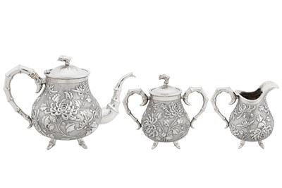 Lot 226 - An early 20th century Chinese export silver three-piece tea service, Canton or Hong Kong circa 1910, marked De Long