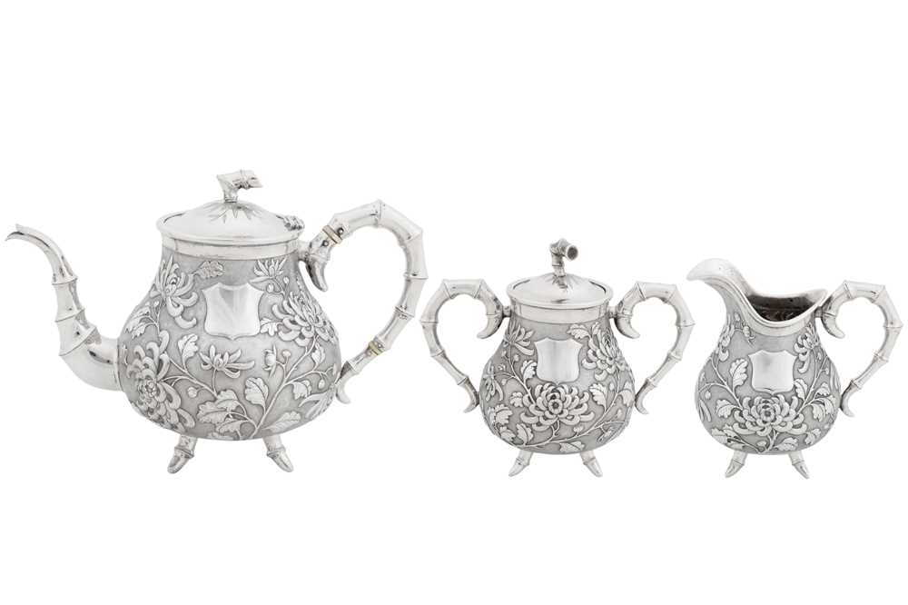 Lot 226 - An early 20th century Chinese export silver three-piece tea service, Canton or Hong Kong circa 1910, marked De Long